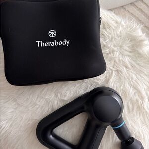 Therabody Black Packaging with Clear Inserts